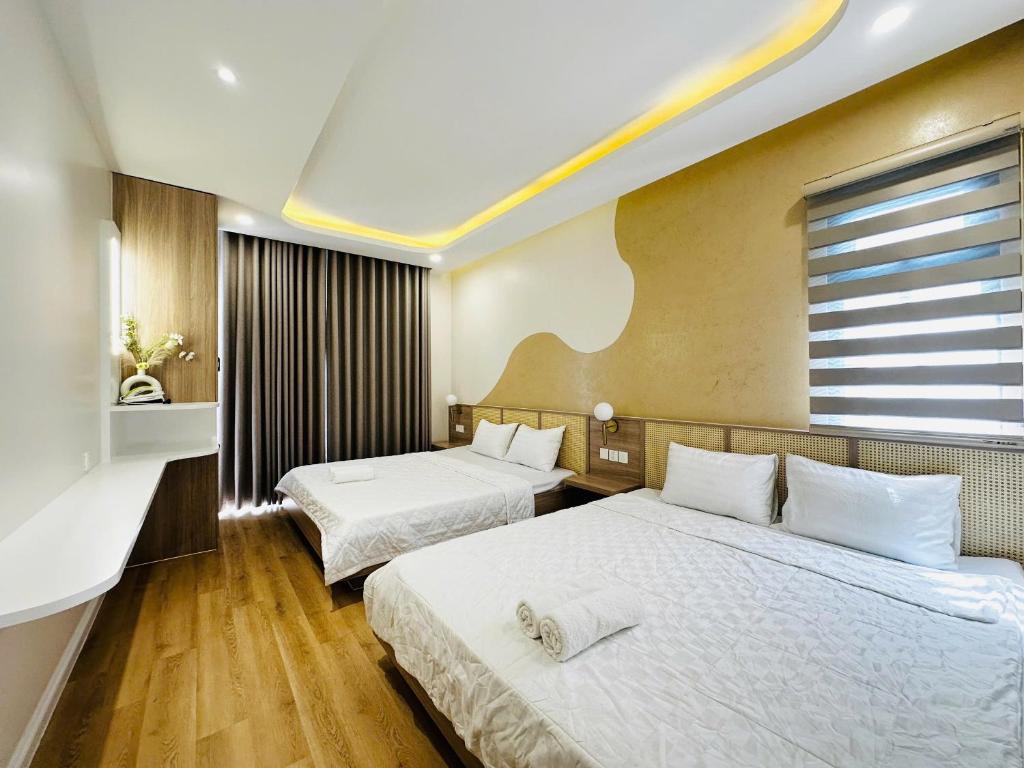 Postel nebo postele na pokoji v ubytování Villa Thuy Nguyen Novaworld