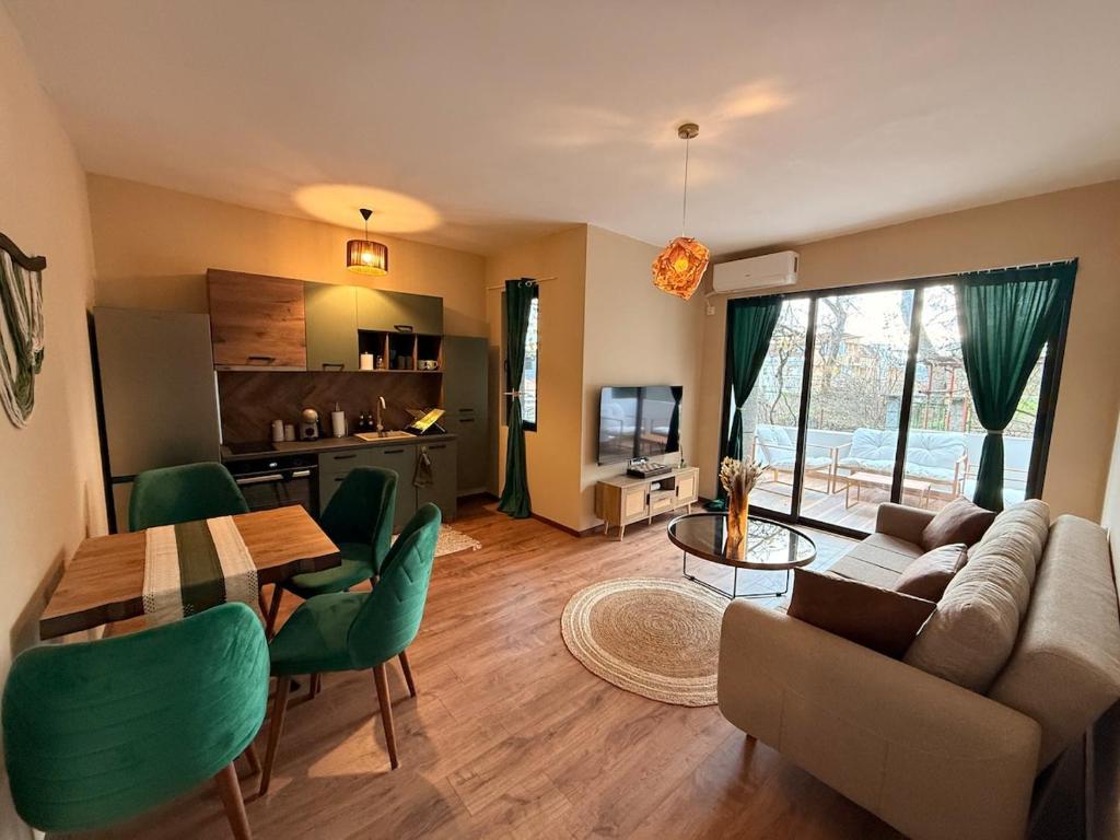 a living room with a couch and a table at Boho Home in Veliko Tŭrnovo