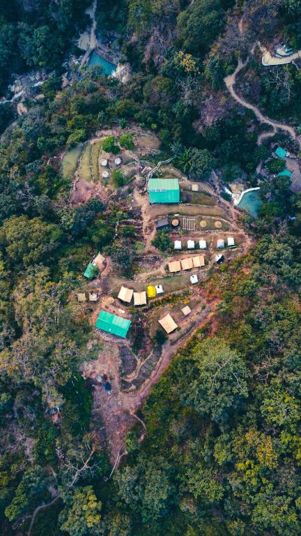 an aerial view of a village on a mountain at Neerville Waterfall Glamping- Neer waterfall in Shivpuri