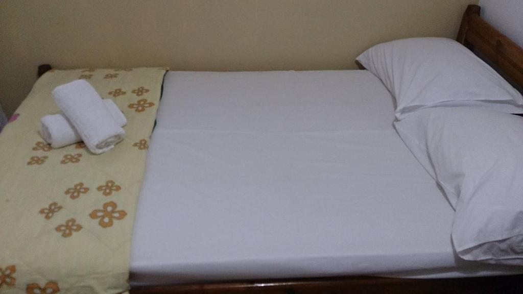 Postel nebo postele na pokoji v ubytování Mikros Paradisos