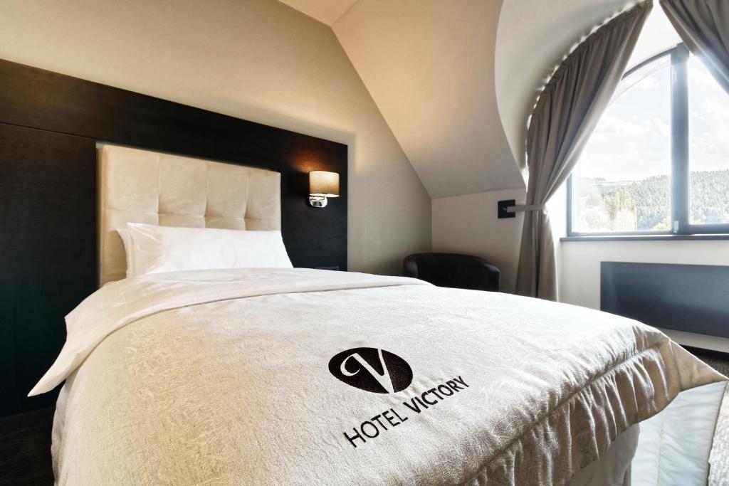 Postel nebo postele na pokoji v ubytování Hotel Victory