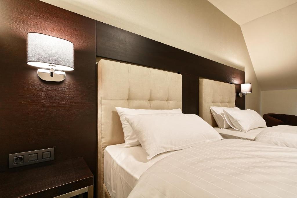 Postel nebo postele na pokoji v ubytování Hotel Victory