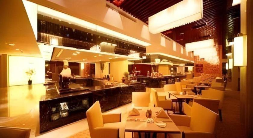 Posezení v ubytování Ramada Plaza by Wyndham Yangzhou Casa