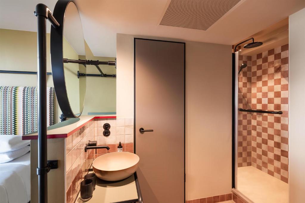 a bathroom with a toilet and a shower at Me and All Hotel Berlin East Side, by Hyatt - NEW OPENING in Berlin