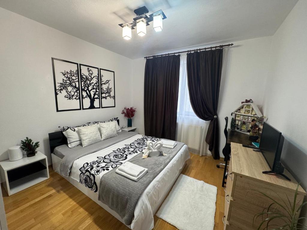 En eller flere senge i et værelse på The Home Feeling