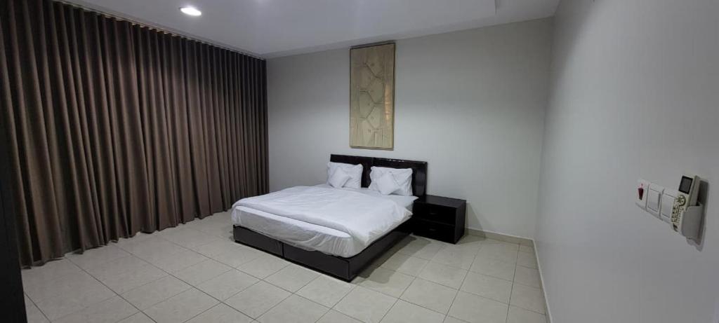 Postel nebo postele na pokoji v ubytování سويت جميل وانيق