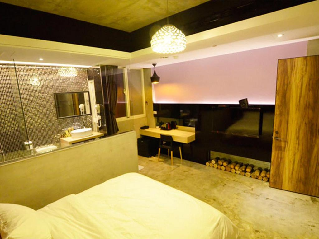 Postel nebo postele na pokoji v ubytování Hotian Inn