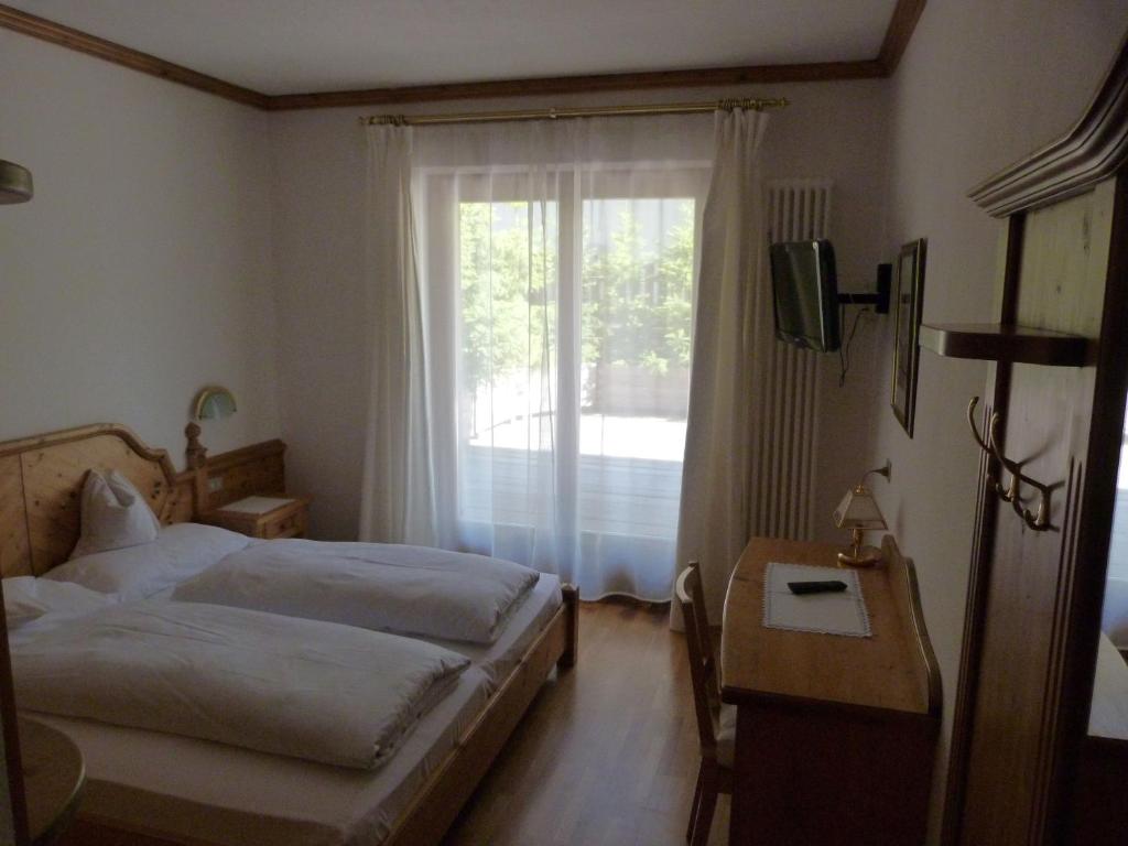 Postel nebo postele na pokoji v ubytování Chalet Ciasa Alexander