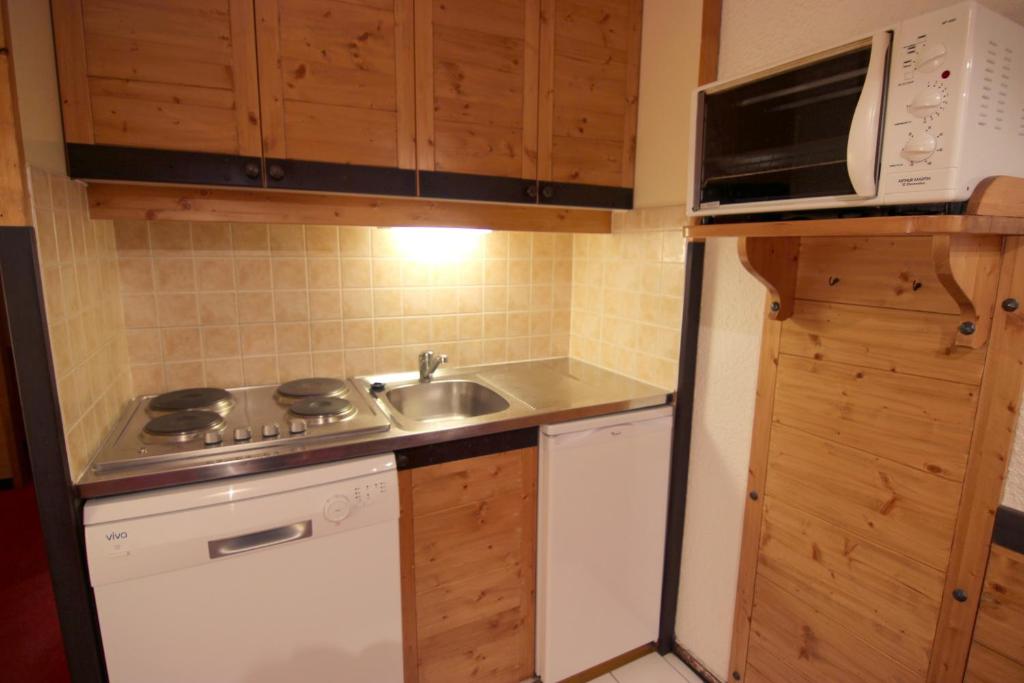 Kuchyň nebo kuchyňský kout v ubytování Hauts De Vanoise Appartements VTI