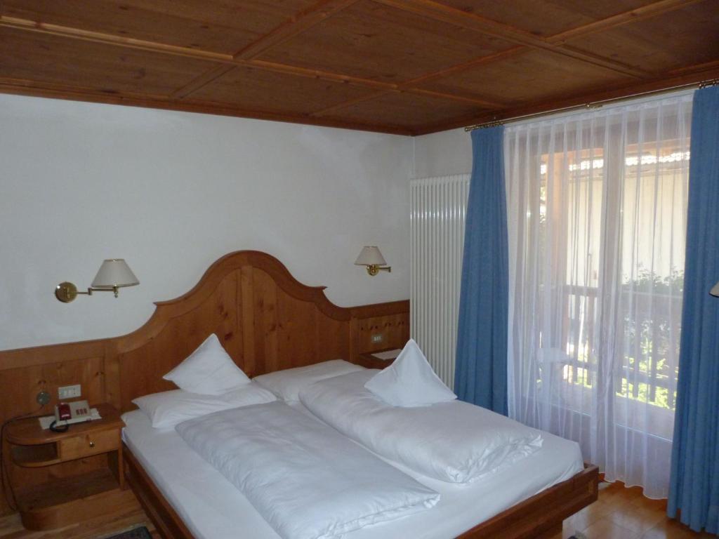 Postel nebo postele na pokoji v ubytování Chalet Ciasa Alexander