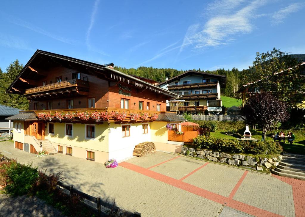 an aerial view of a building with flowers on it at Pension Mozart in Wagrain