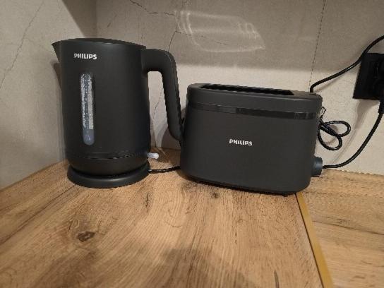 a black appliance sitting on top of a wooden table at Miejscówka Werlas in Werlas