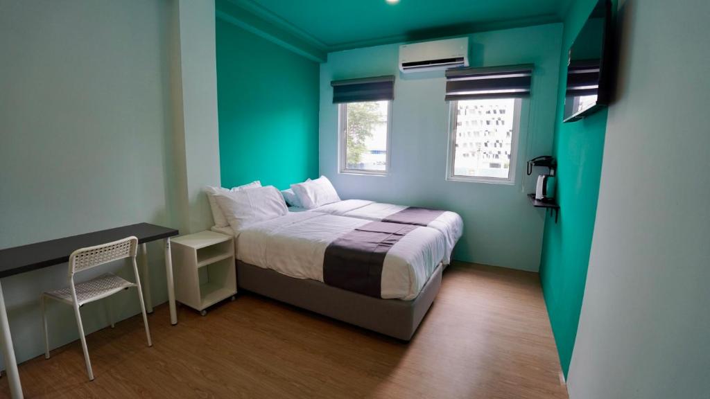 En eller flere senge i et værelse på Alami Garden Hotel Kuala Lumpur