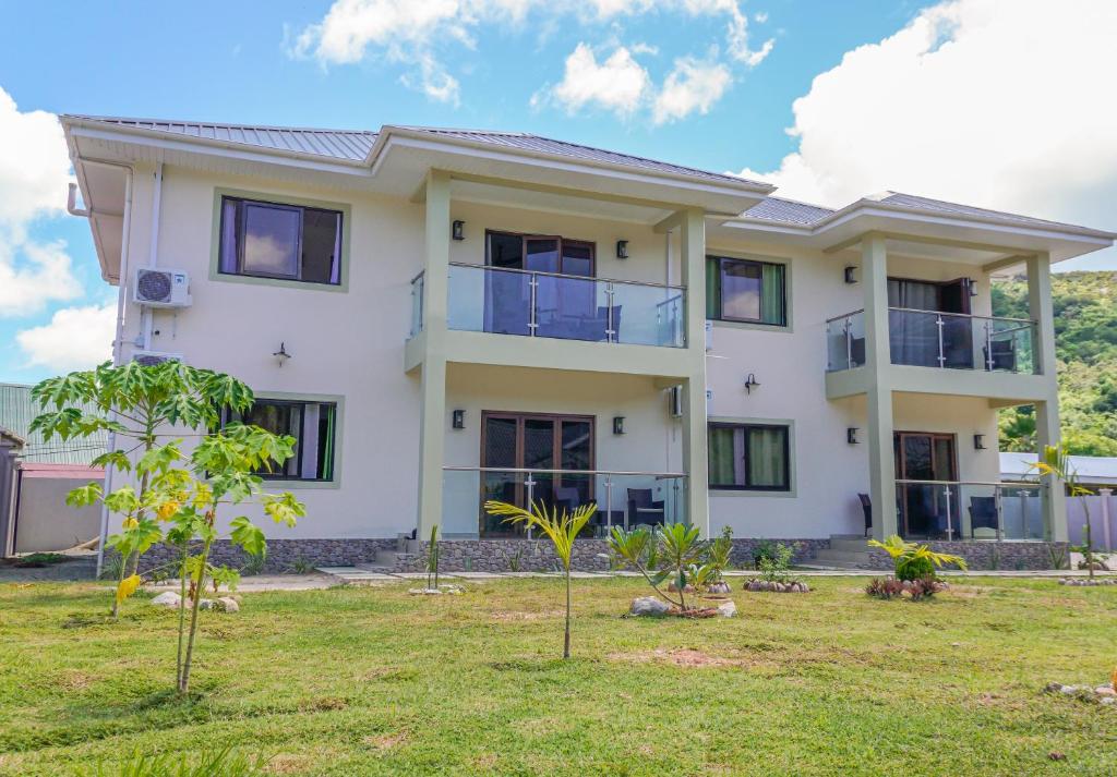 an image of a house with a yard at Yvon's Tropical Villa in Grand Anse