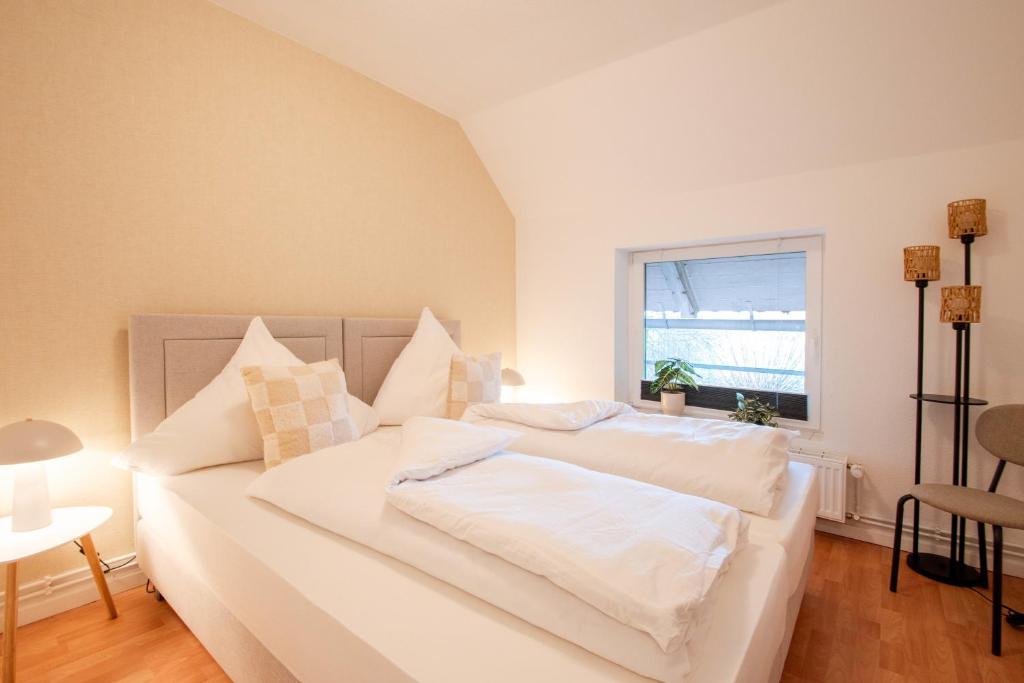 Voodi või voodid majutusasutuse Elbe52 - by BohnApartments- Nähe Elbe- WLAN- Parken toas