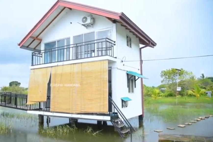 a house in the middle of a flooded street at Kataragama leopard One Villa Yala in Gotamegama