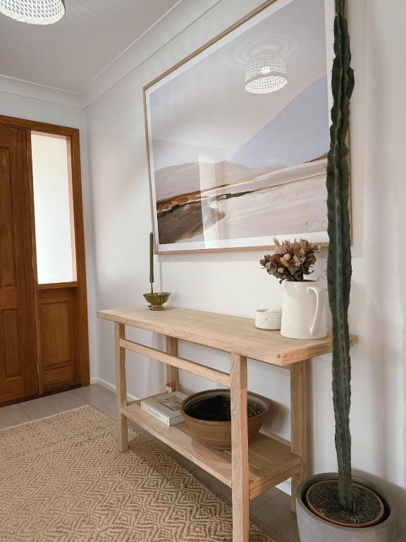 a room with a table with a mirror and a cactus at Lonny Coastal Escape in Point Lonsdale