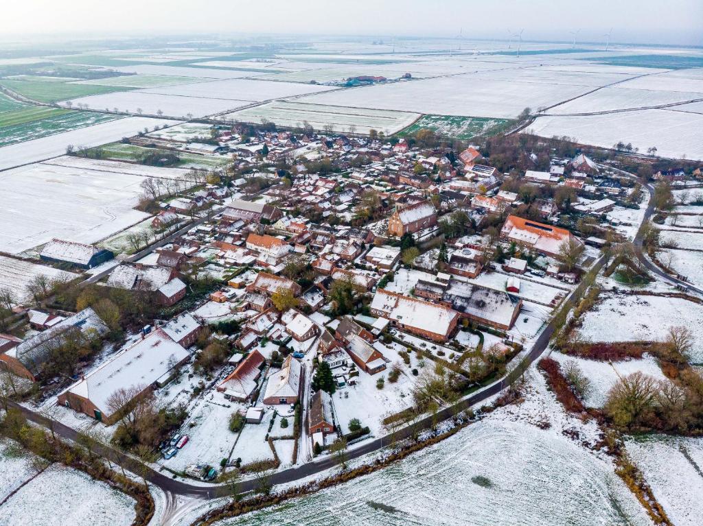 an aerial view of a town in the snow at Ferienwohnung Hummer in Manslagt