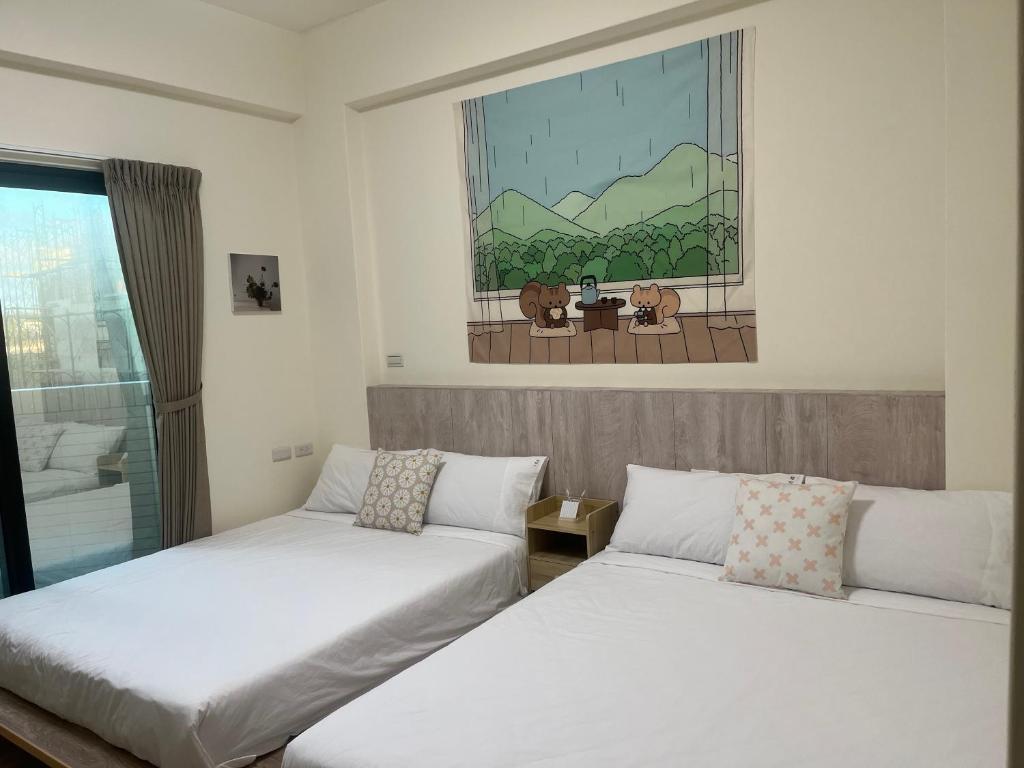 Postel nebo postele na pokoji v ubytování Jia Zizai B&B