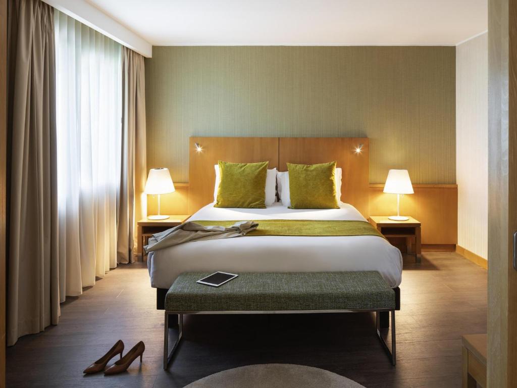 Ένα ή περισσότερα κρεβάτια σε δωμάτιο στο Hotel Mercure Porto Gaia