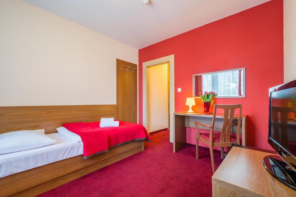 TV a/nebo společenská místnost v ubytování Hotel Slovan