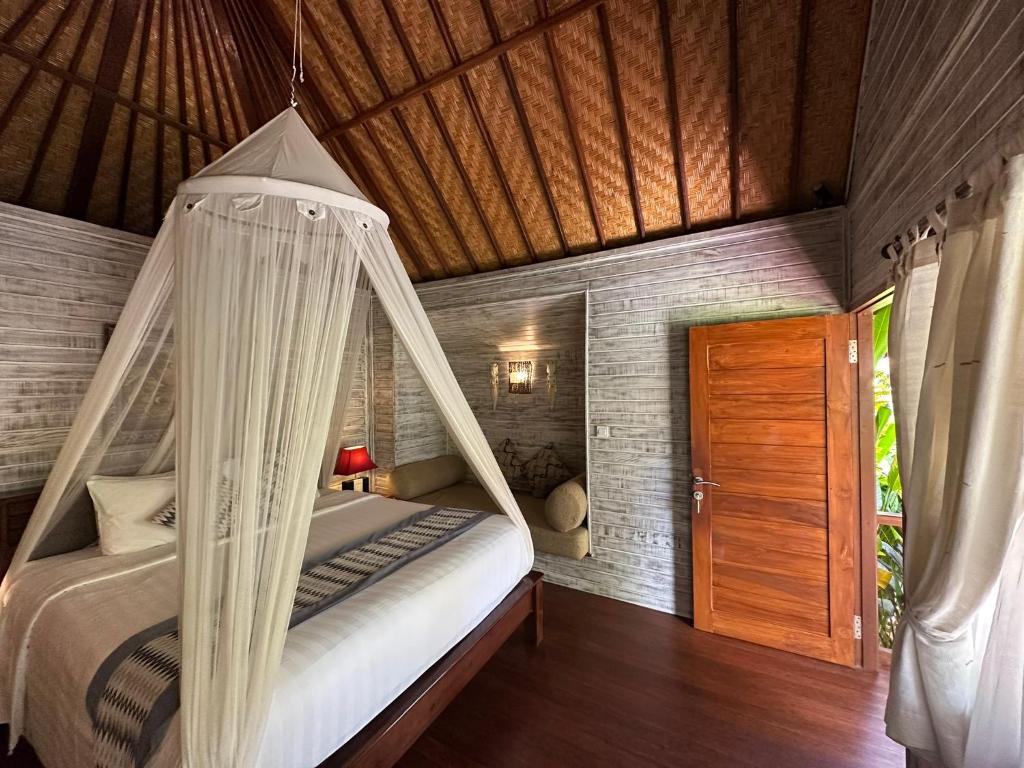 Кровать или кровати в номере Pondok Lembongan