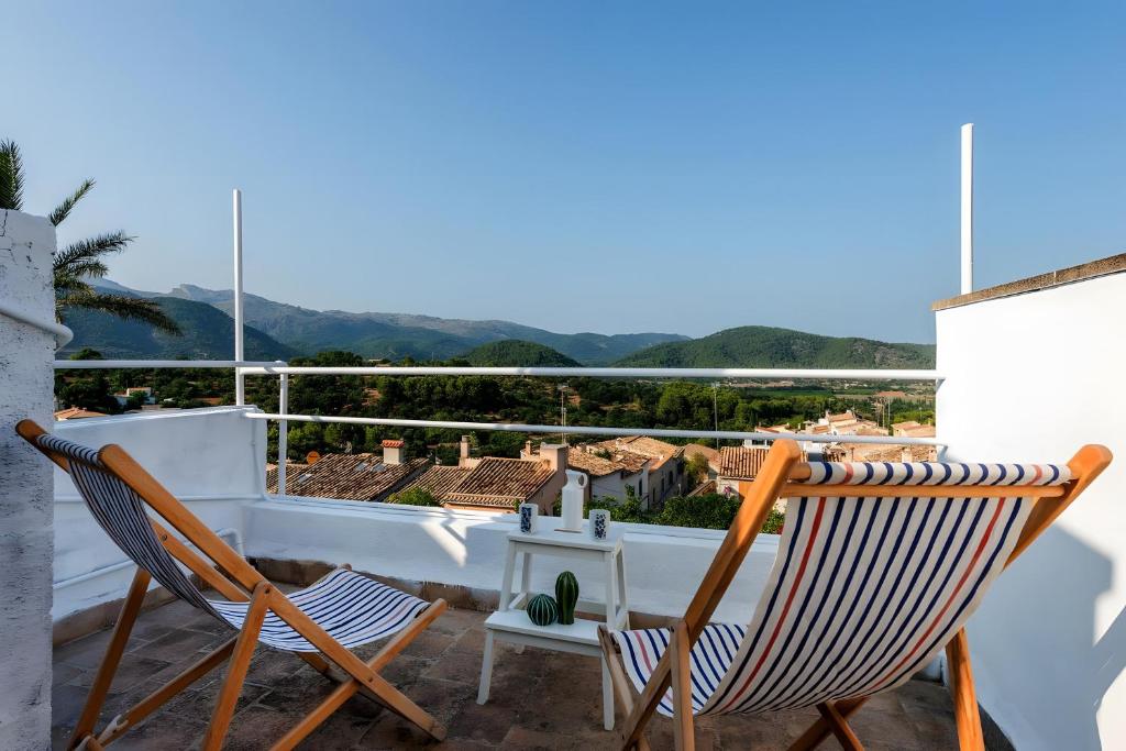 a pair of chairs on a balcony with a view at Sant Miquel in Campanet