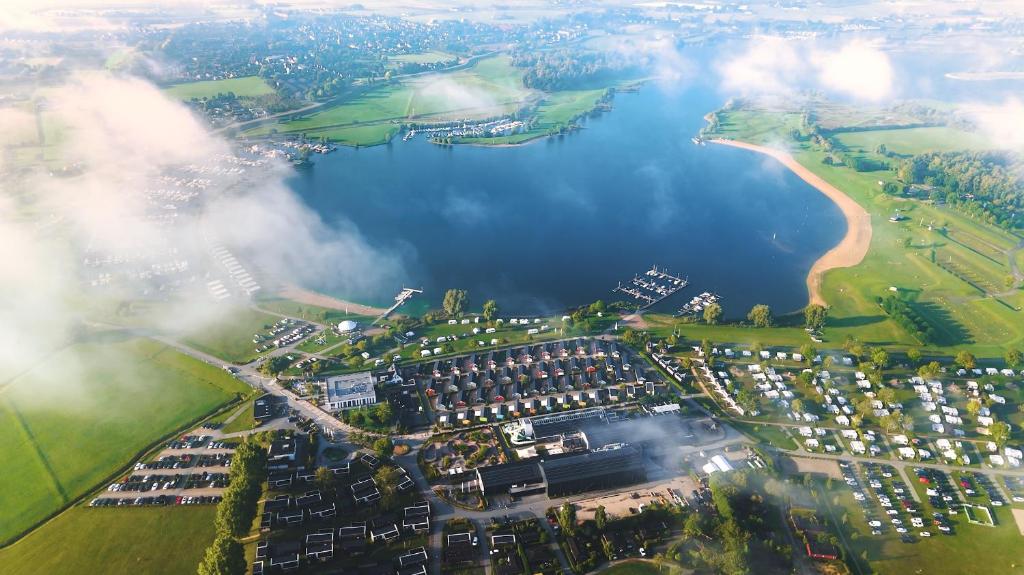 an aerial view of a city and a lake at Vakantiepark Eiland van Maurik in Maurik