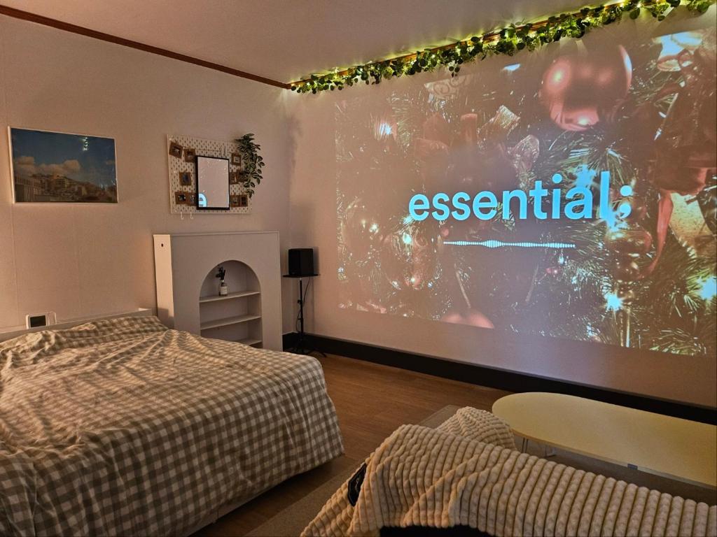 En eller flere senge i et værelse på Bomstay in Choryang