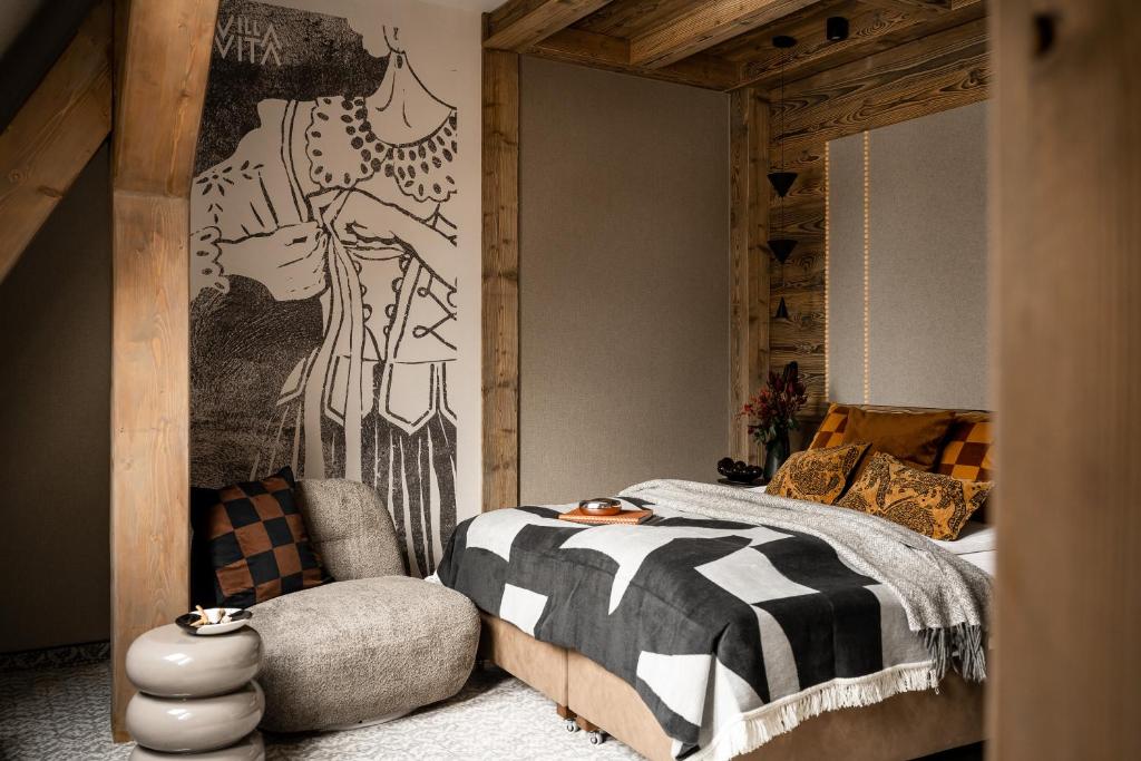 Un pat sau paturi într-o cameră la Villa Vita Krupówki