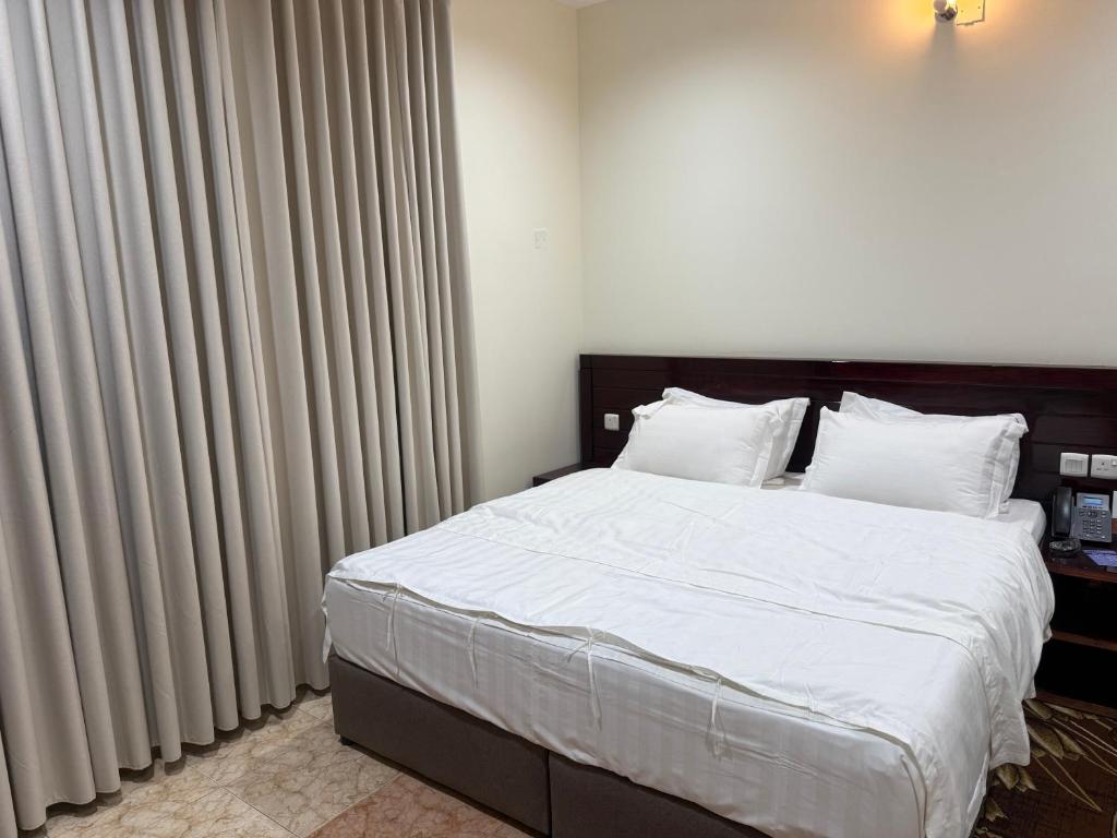 Ένα ή περισσότερα κρεβάτια σε δωμάτιο στο Sanabel ALmshaan Hotel