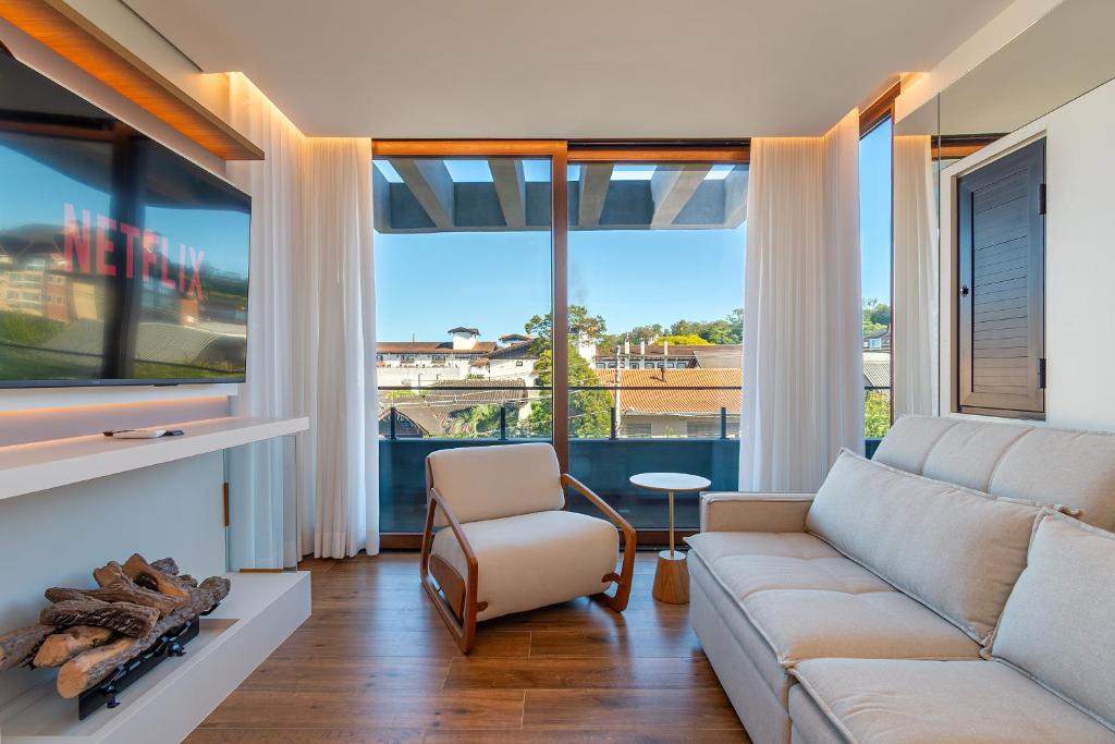 Χώρος καθιστικού στο Apartamento com jacuzzi no centro de Gramado