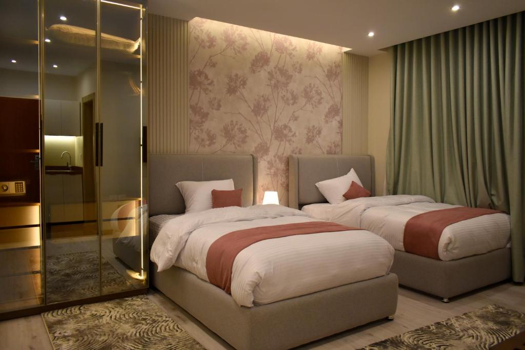 Giường trong phòng chung tại Stay Inn 51 Hotel