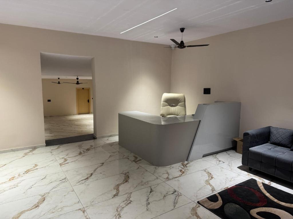 a office with a chair and a desk and a couch at Hotel The Luxury Inn in Nāgaur