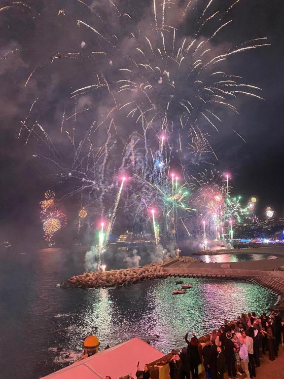 a crowd of people watching a fire show with fireworks at Funchal Center Apartment I in Funchal