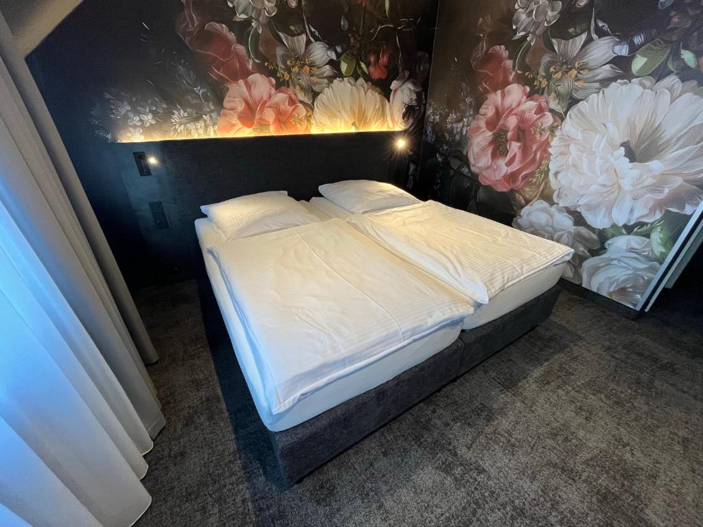 Ένα ή περισσότερα κρεβάτια σε δωμάτιο στο Hotel Elsen