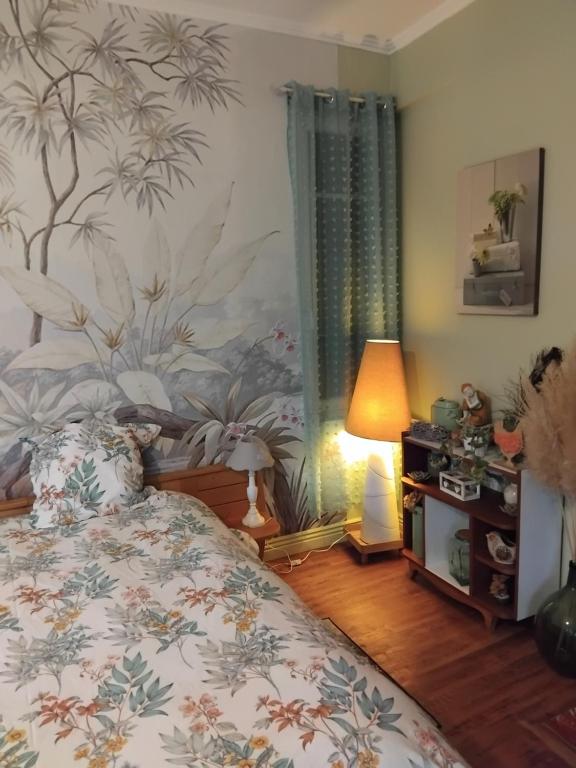 Ένα ή περισσότερα κρεβάτια σε δωμάτιο στο Le jardin de Christine