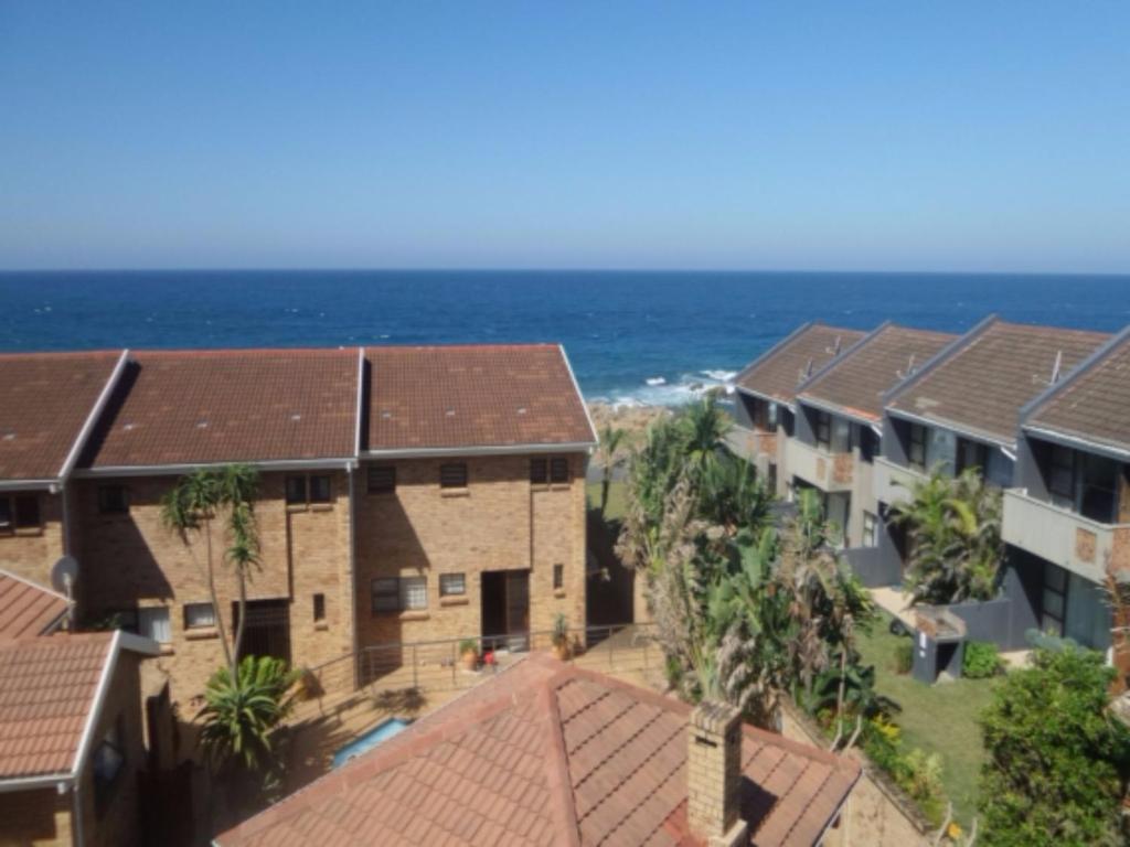 an aerial view of a building with the ocean in the background at Villa Siesta Flat No.8 in Margate