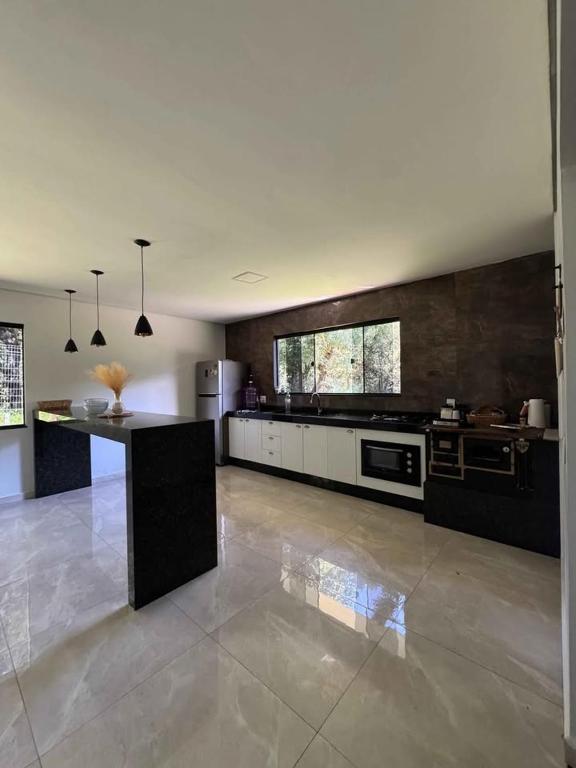 Kuchyň nebo kuchyňský kout v ubytování Recanto Rivière