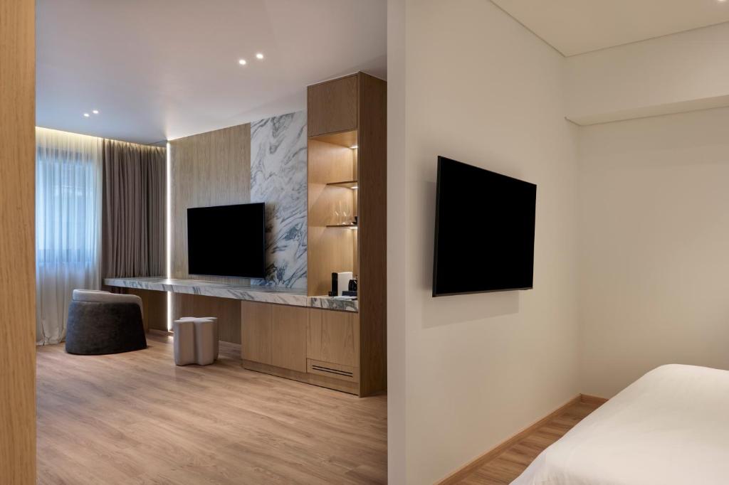 TV a/nebo společenská místnost v ubytování Nur City Suites