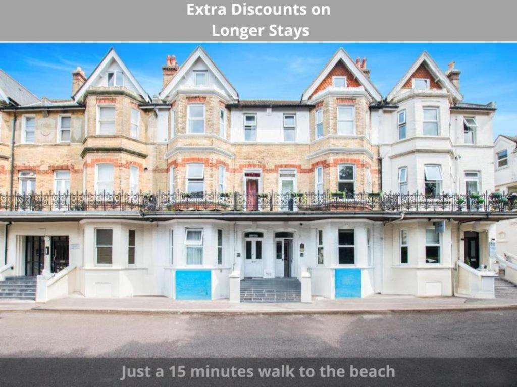 an image of an apartment building with the words extra discounts on longer stays at OYO The Lodge Bournemouth in Bournemouth