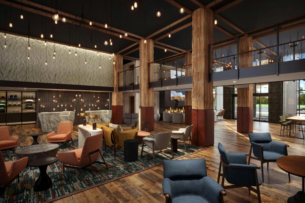 a rendering of a lobby with chairs and tables at Hotel Thaynes, Park City, a Tribute Portfolio Hotel in Park City