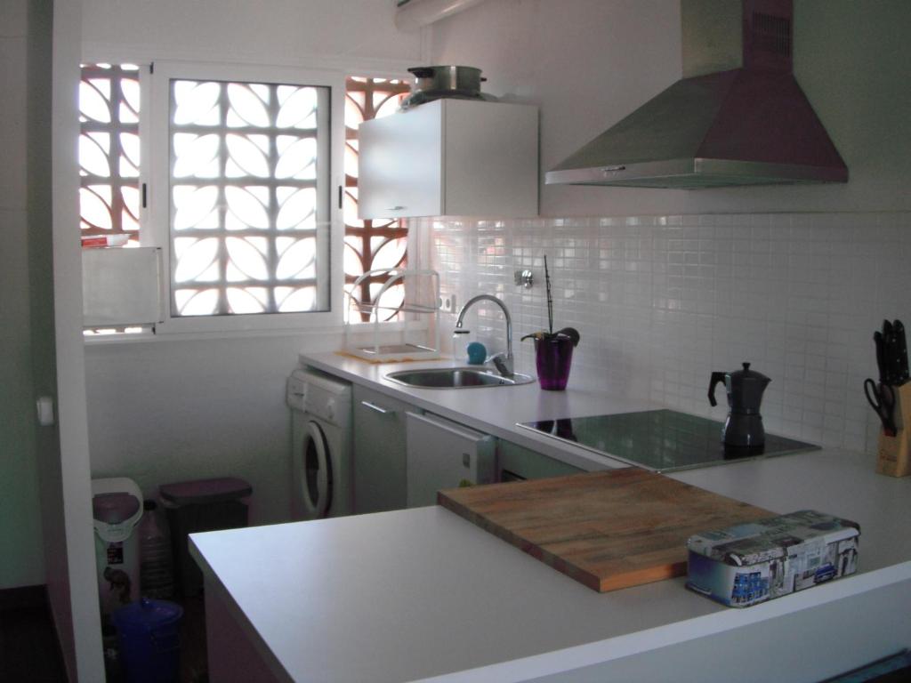 a kitchen with a sink and a counter top at Del Rodriguez in Cunit