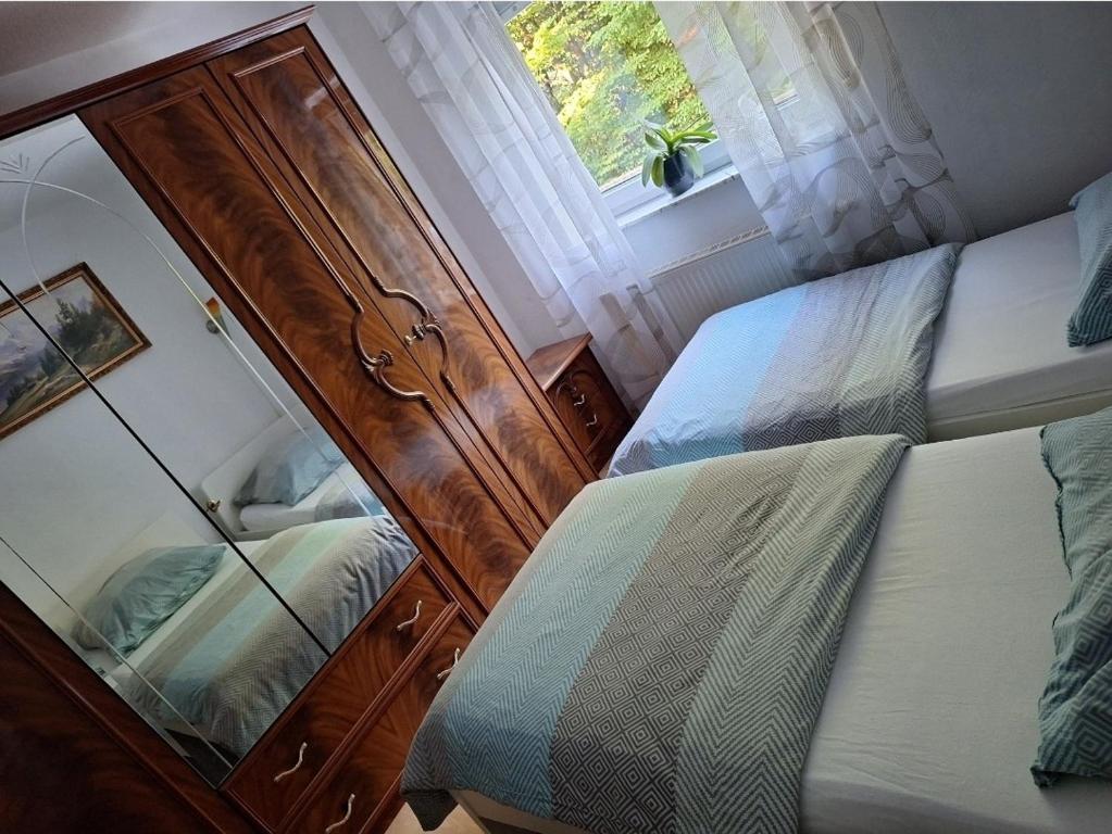 Ένα ή περισσότερα κρεβάτια σε δωμάτιο στο Ferienwohnung Lilia