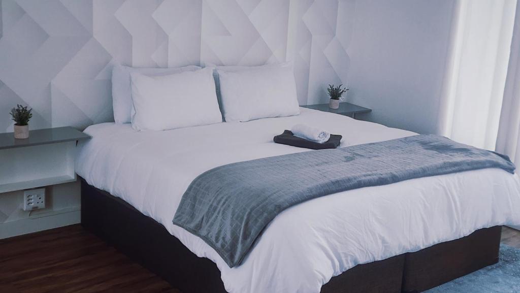 En eller flere senge i et værelse på Casa lux boutique guest house