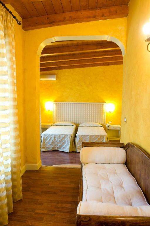 Voodi või voodid majutusasutuse Park Hotel Villaferrata toas