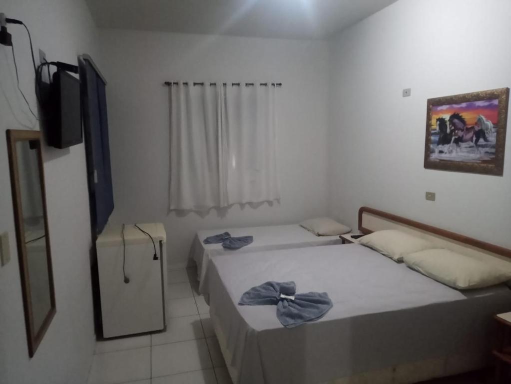 Uma cama ou camas num quarto em Hotel Internacional