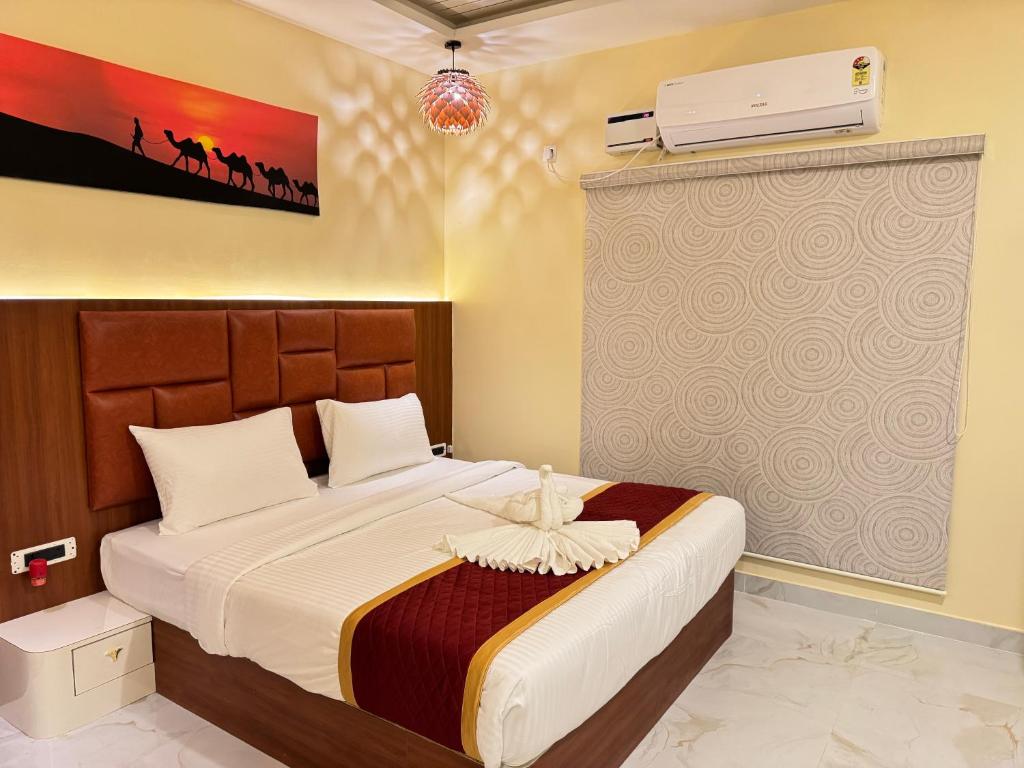 Ένα ή περισσότερα κρεβάτια σε δωμάτιο στο Road House Resort