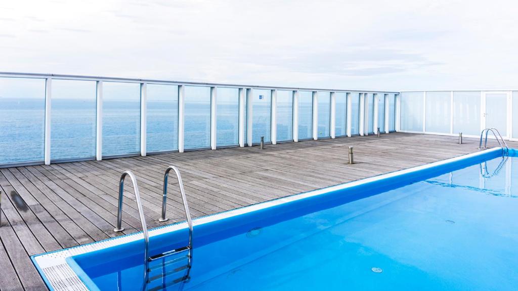 a swimming pool on the deck of a cruise ship at Apartament 208 in Międzyzdroje