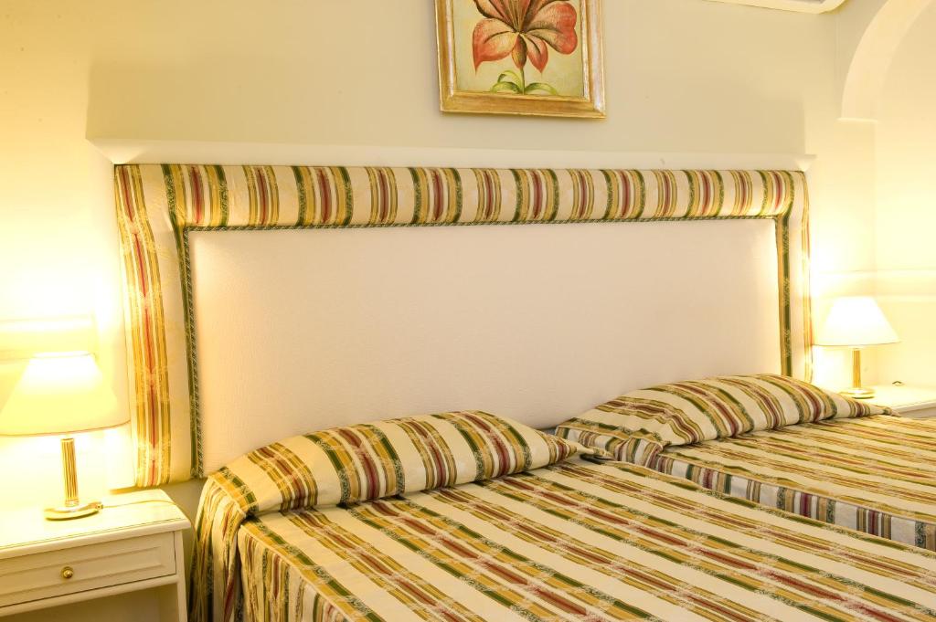 Voodi või voodid majutusasutuse Park Hotel Villaferrata toas